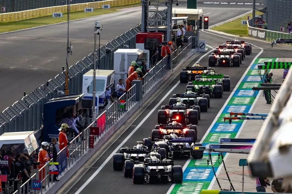 The field queues in the pit lane towards the end of the red flag stoppage