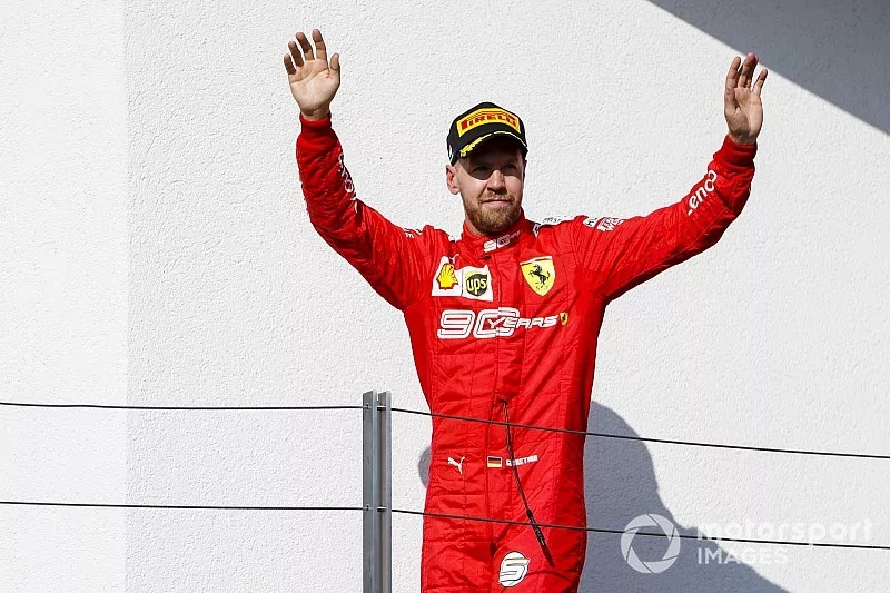 Sebastian Vettel, Ferrari, 3rd position, arrives on the podium