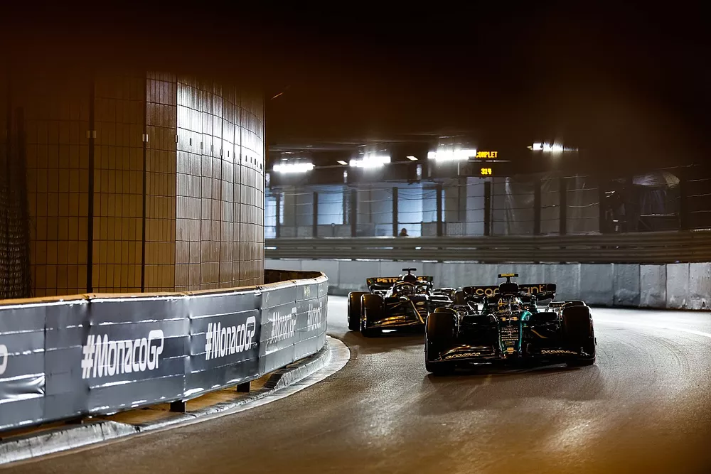 Fernando Alonso, Aston Martin AMR23, leads George Russell, Mercedes F1 W14