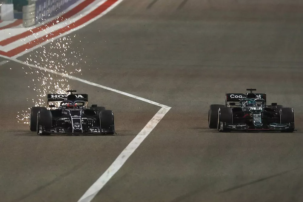 Sparks fly as Yuki Tsunoda, AlphaTauri AT02, battles with Lance Stroll, Aston Martin AMR21