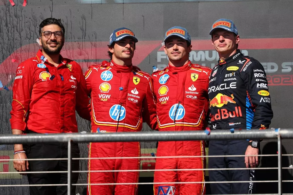 Charles Leclerc, Scuderia Ferrari, 1st position, Carlos Sainz, Scuderia Ferrari, 2nd position, Max Verstappen, Red Bull Racing, 3rd position, on the podium 