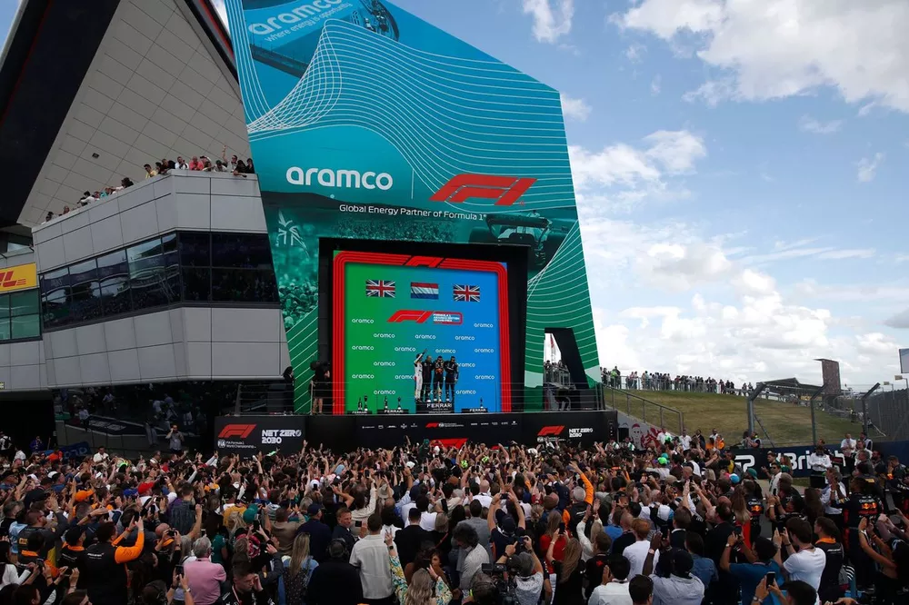 Lando Norris, McLaren, 2nd position, Max Verstappen, Red Bull Racing, 1st position, Lewis Hamilton, Mercedes-AMG, 3rd position, on the podium
