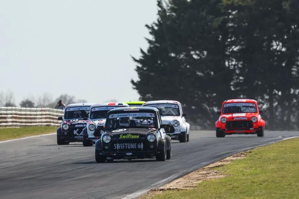 Rupert Deeth (23) won the first Mini Miglia race ahead of Ian Cursley (5)