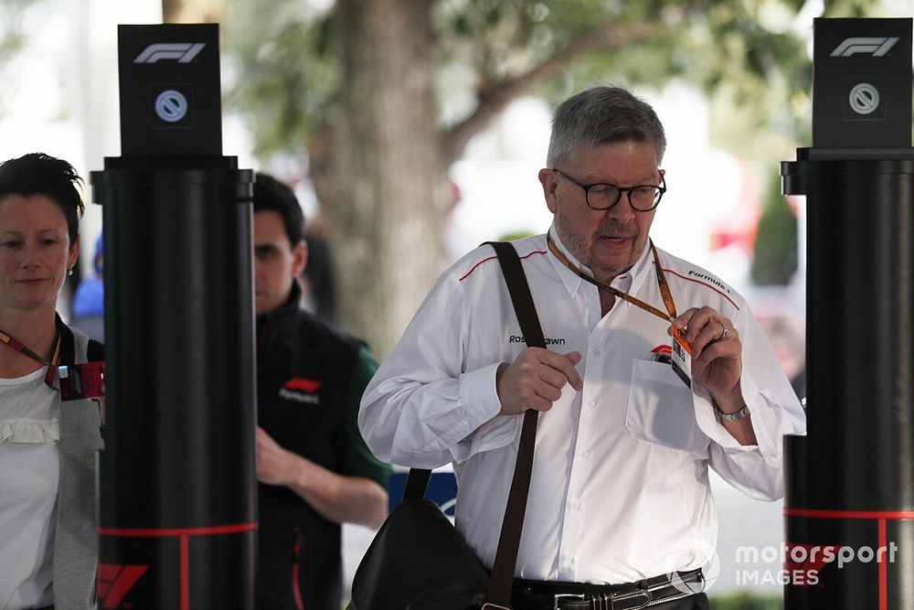 Ross Brawn, Managing Director of Motorsports, FOM, arrives in the paddocl