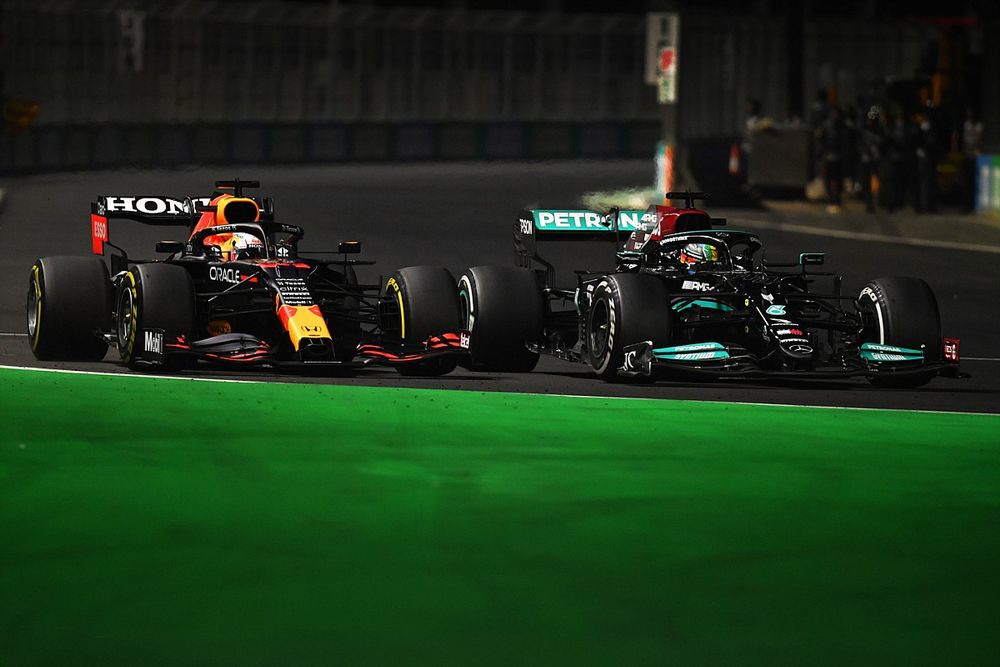 Max Verstappen, Red Bull Racing RB16B, battles with Lewis Hamilton, Mercedes W12