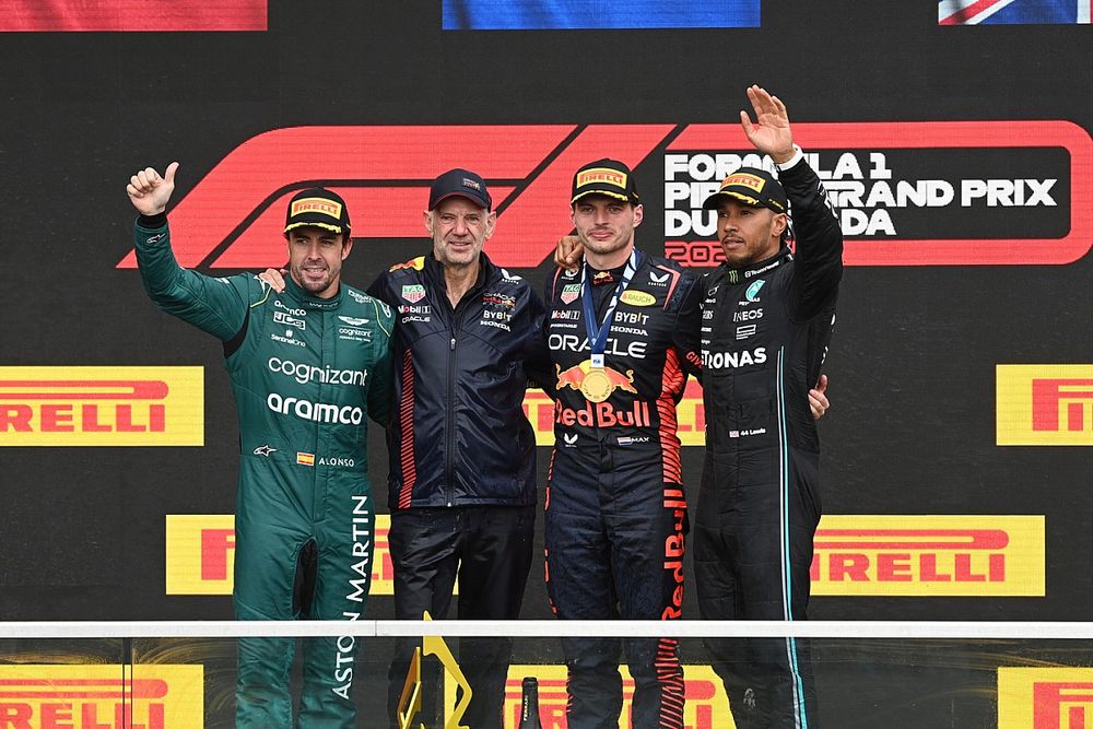 Fernando Alonso, Aston Martin F1 Team, 2nd position, Adrian Newey, Chief Technology Officer, Red Bull Racing, Max Verstappen, Red Bull Racing, 1st position, Lewis Hamilton, Mercedes-AMG, 3rd position, on the podium