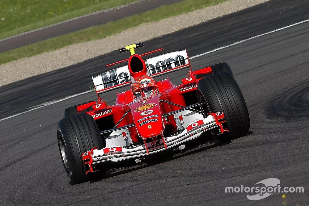Valentino Rossi, drives the Ferrari F2004, in what was to be a top secret test and he wears one of M