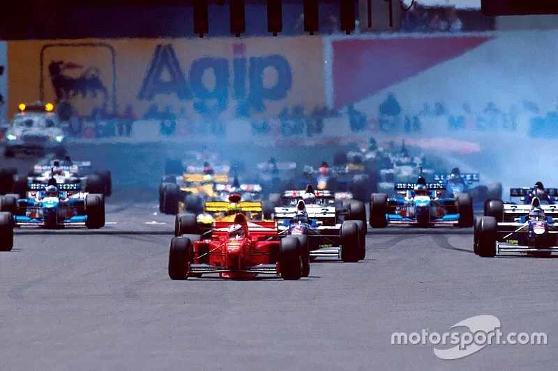 Start action, Michael Schumacher, Ferrari F310B leads