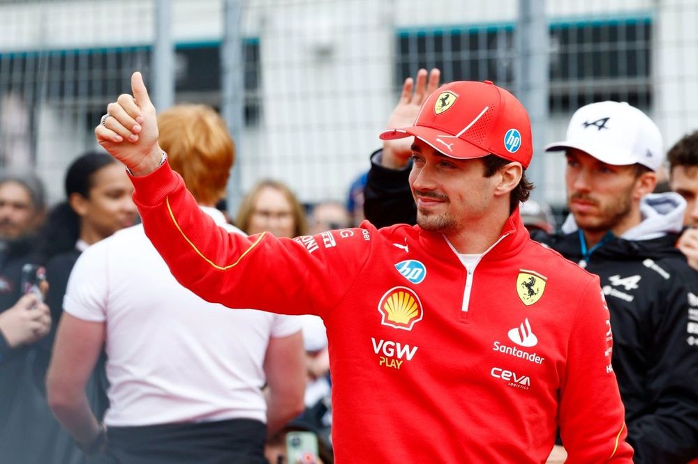 Charles Leclerc, Scuderia Ferrari, waves at the crowds ahead of the drivers parade 