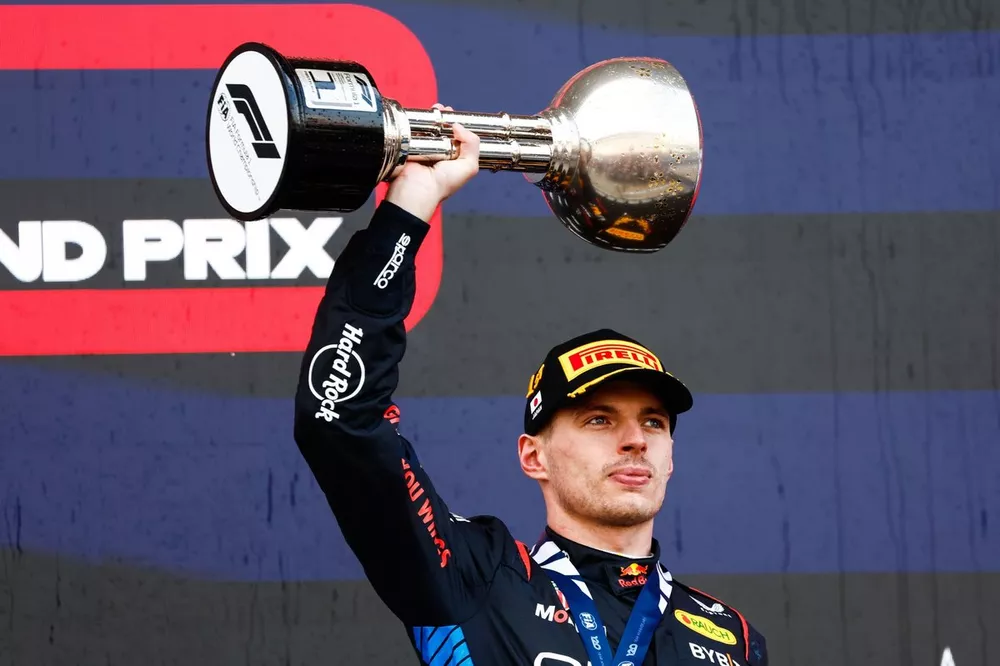 Max Verstappen, Red Bull Racing, 1st position, lifts the trophy in celebration