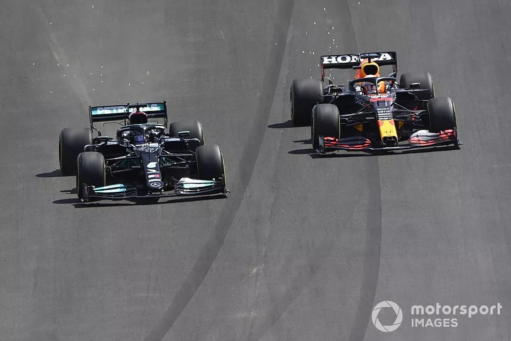 Lewis Hamilton, Mercedes W12, passes Max Verstappen, Red Bull Racing RB16B