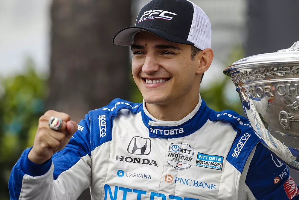 Alex Palou, Chip Ganassi Racing Honda with the Astor Cup as he celebrates on the championship podium