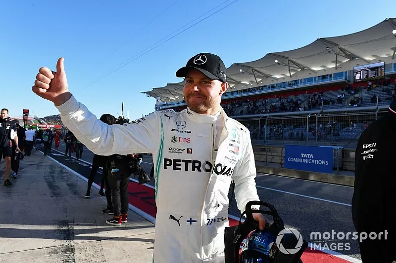 Valtteri Bottas, Mercedes AMG W10, celebrates after taking Pole Position