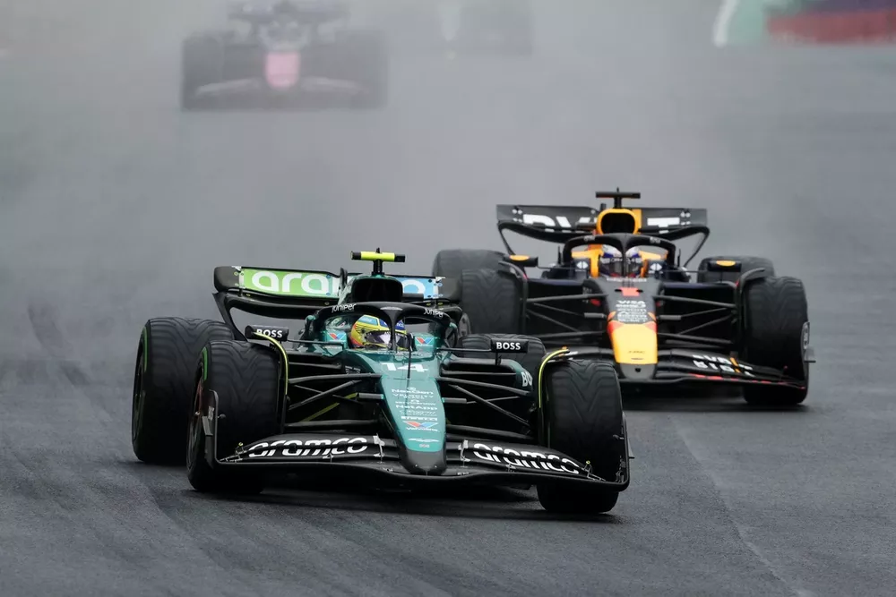 Fernando Alonso, Aston Martin AMR24, leads Max Verstappen, Red Bull Racing RB20, and Pierre Gasly, Alpine A524