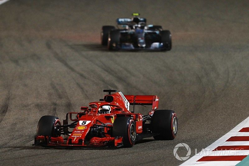 Sebastian Vettel, Ferrari SF71H, leads Valtteri Bottas, Mercedes AMG F1 W09