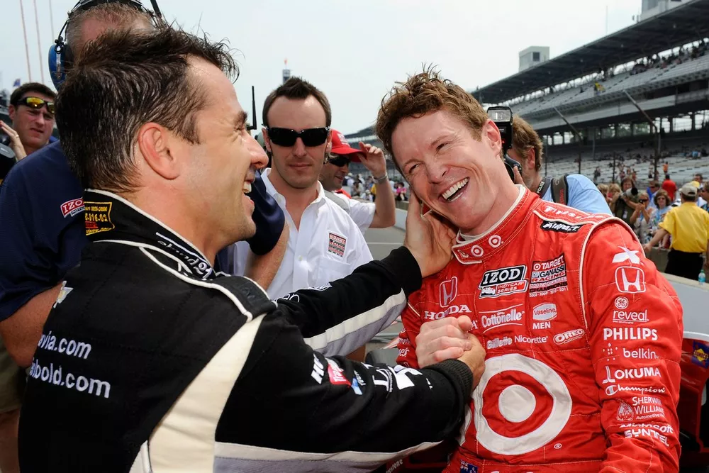Oriol Servia,  congratulates Pit Stop Challenge winner Scott Dixon