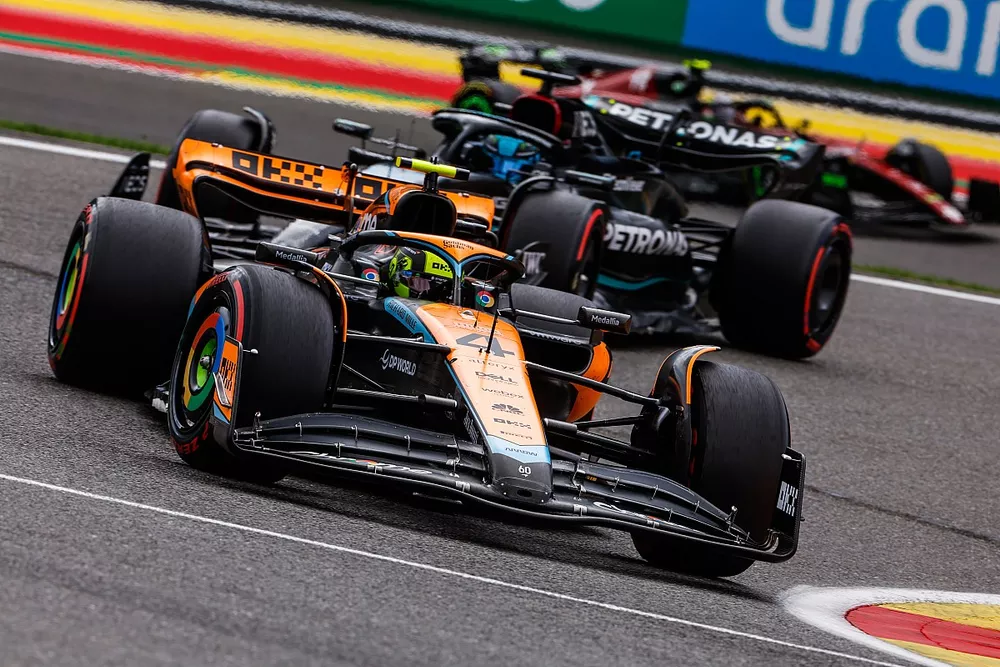 Lando Norris, McLaren MCL60, leads George Russell, Mercedes F1 W14