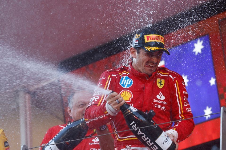 Charles Leclerc, Scuderia Ferrari, 1st position, sprays the victory Champagne on the podium