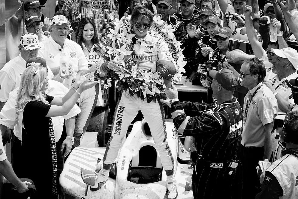 2011 Indy 500 race winner Dan Wheldon, Bryan Herta Autosport with Curb / Agajanian celebrates