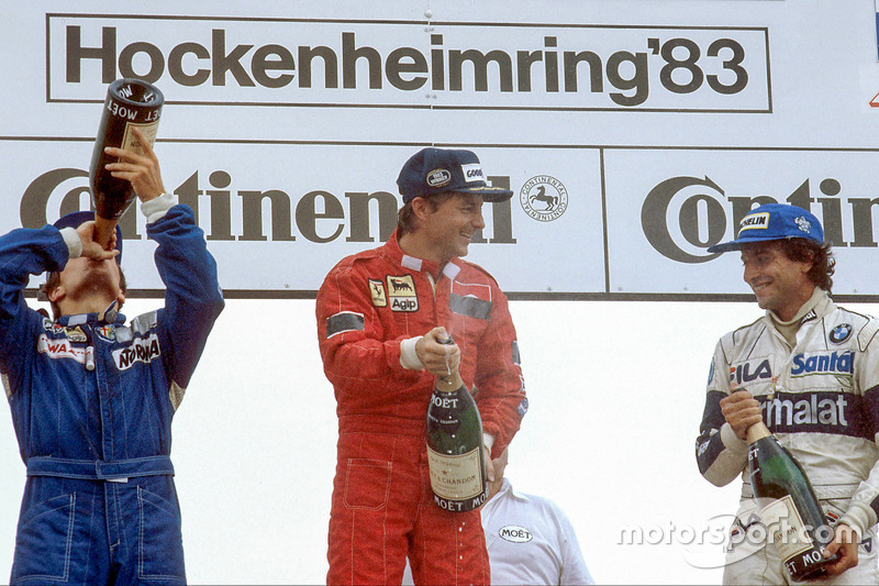 Rene Arnoux, 1st position, Andrea de Cesaris, 2nd position and Riccardo Patrese, 3rd position celebrate on the podium