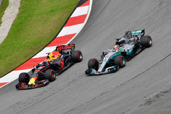 Max Verstappen, Red Bull Racing RB13 passes Lewis Hamilton, Mercedes-Benz F1 W08 for the lead