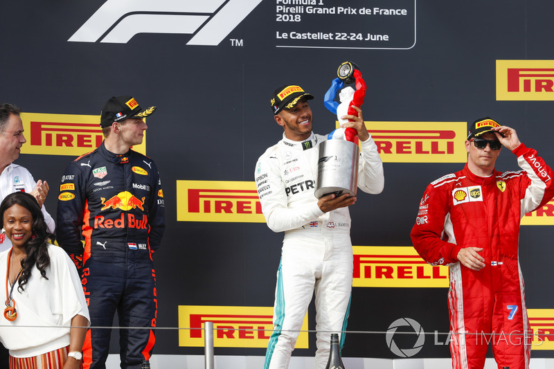 Max Verstappen, Red Bull Racing, 2nd position, Lewis Hamilton, Mercedes AMG F1, 1st position, with his trophy, Kimi Raikkonen, Ferrari, 3rd position, on the podium