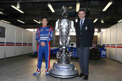 Indy 500 winner Takuma Sato, Andretti Autosport with the Borg-Warner Trophy and Scott Gallett, VP of marketing at BorgWarner Inc.