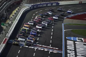 Kyle Busch, Joe Gibbs Racing, Toyota and Ross Chastain, Kaulig Racing, Chevrolet Camaro lead the field at the race start