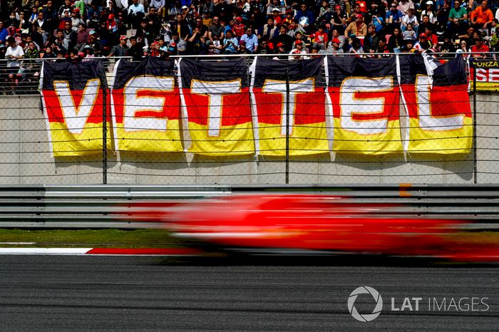 Sebastian Vettel, Ferrari SF71H, flashes past fans in a grandstand