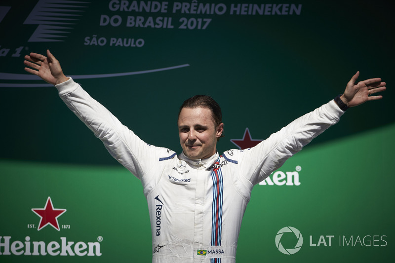 Felipe Massa, Williams, waves to his home fans from the podium after his final home race