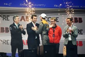 Rene Rast, NEOM McLaren Formula E Team, 3rd position, is greeted on the podium by Alberto Longo, Deputy CEO, Chief Championship Officer, Formula E, Alejandro Agag, Chairman, Formula E