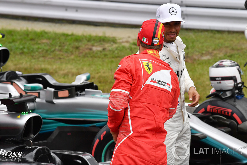 Sebastian Vettel, Ferrari and Lewis Hamilton, Mercedes AMG F1 in parc ferme