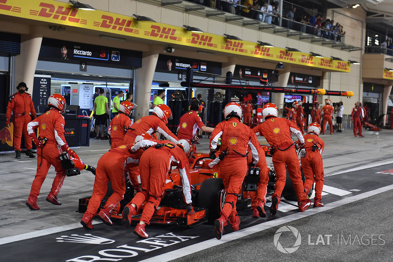 The car of Kimi Raikkonen, Ferrari SF71H is pushed back in pit lane