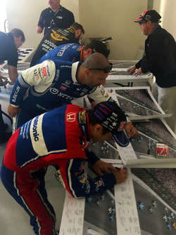 Drivers sign Justin Wilson poster