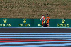 Marshals recover the rear wheel of Sergio Perez, Force India VJM11 in FP2