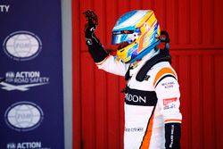 Fernando Alonso, McLaren, waves to his fans from Parc Ferme after Qualifying