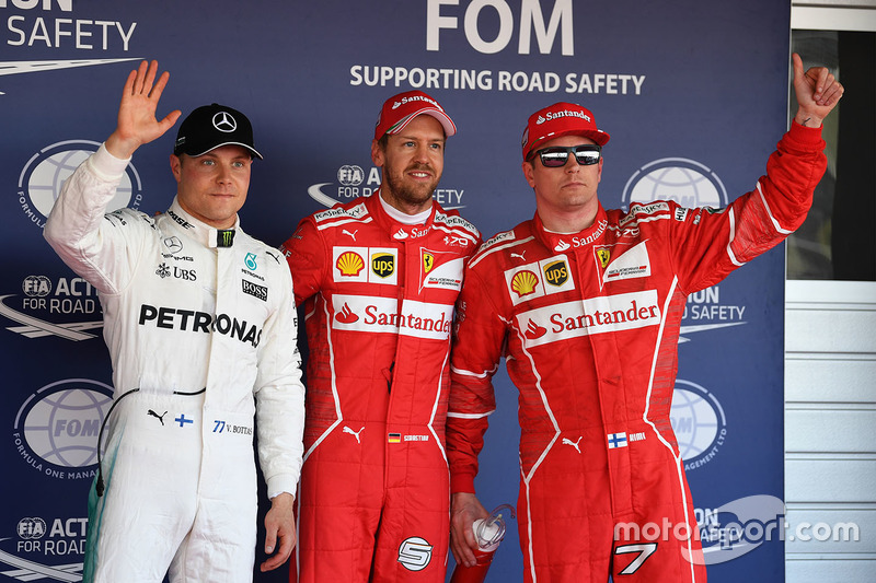 Polesitter Sebastian Vettel, Ferrari, second place Kimi Raikkonen, Ferrari, third place Valtteri Bot