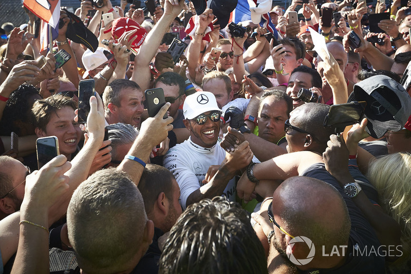 Lewis Hamilton, Mercedes AMG F1, gets mobbed by fans