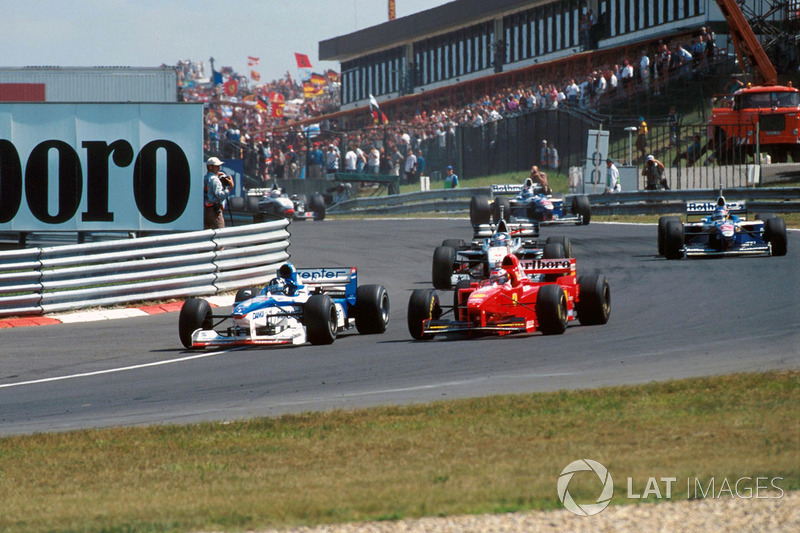 Damon Hill. Arrows A18, Michael Schumacher, Ferrari F310B