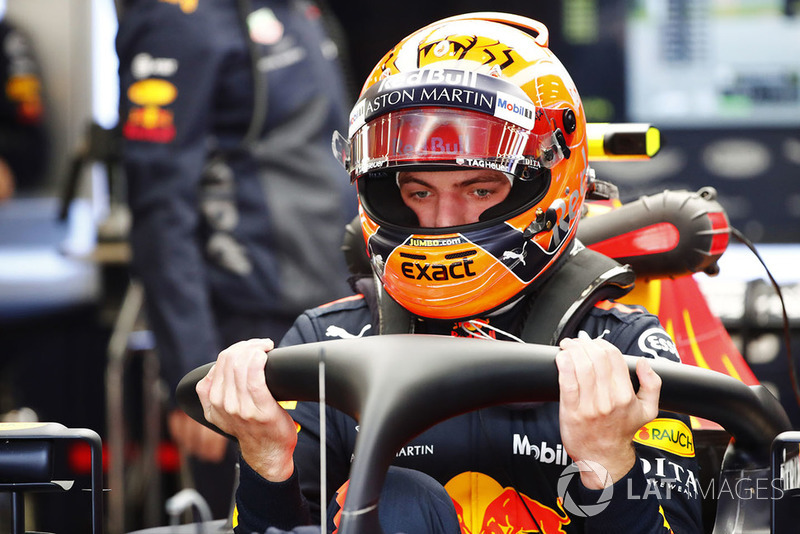 Max Verstappen, Red Bull Racing, enters his cockpit