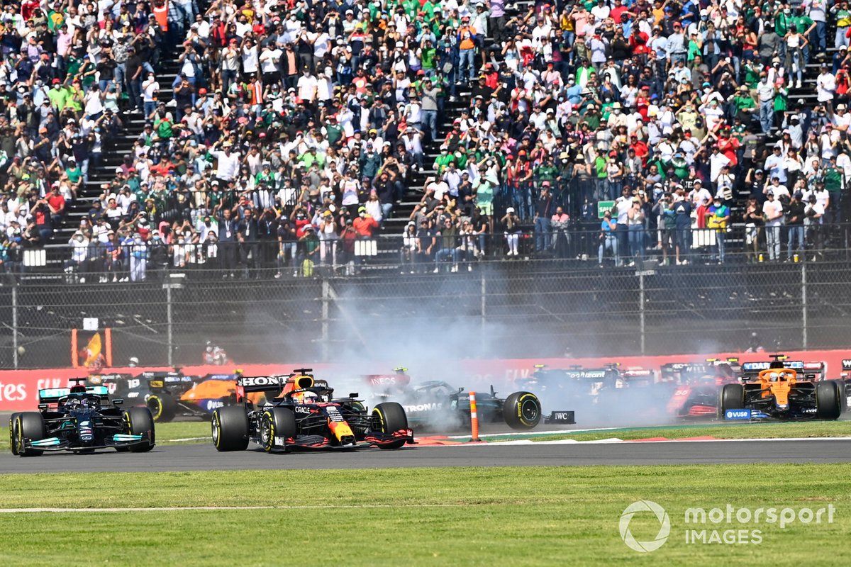 Max Verstappen, Red Bull Racing RB16B, Lewis Hamilton, Mercedes W12, as Valtteri Bottas, Mercedes W12, spins and Daniel Ricciardo, McLaren MCL35M, runs wide at the start