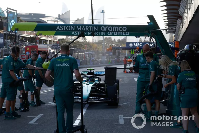 Fernando Alonso, Aston Martin AMR24, in the pit lane 