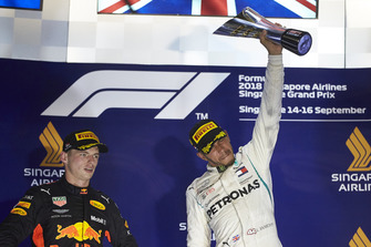 Max Verstappen, Red Bull Racing, 2nd position, and Lewis Hamilton, Mercedes AMG F1, 1st position, with his trophy
