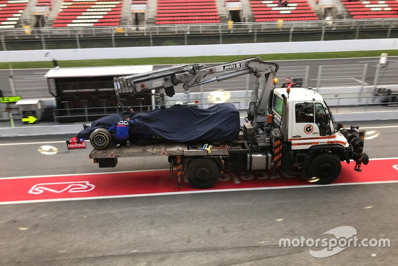 The car of Alex Albon, Scuderia Toro Rosso STR14, on the back of a truck in pit lane