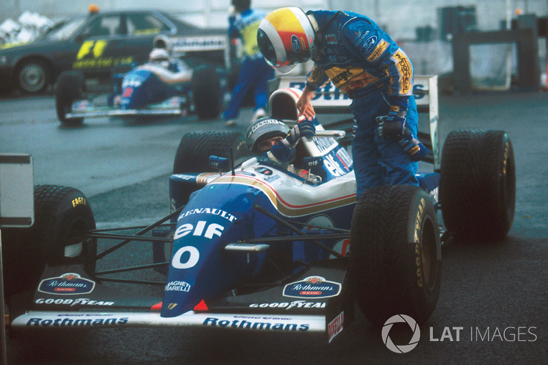 Winner Damon Hill, Williams, is congratulated by second place Michael Schumacher, Benetton