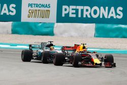 Max Verstappen, Red Bull Racing RB13, passes Lewis Hamilton, Mercedes AMG F1 W08 for the lead