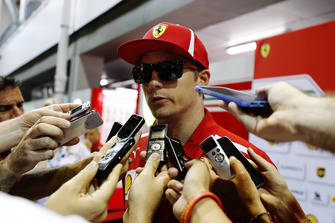 Kimi Raikkonen, Ferrari, talks to the media