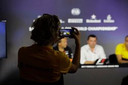 A Renault Sport F1 Team PR representative takes a picture of Bob Fernley, Deputy Team Principal, Force India, Eric Boullier, Racing Director, McLaren, Cyril Abiteboul, Managing Director, Renault Sport F1 Team, in the Team Principals' Press Conference