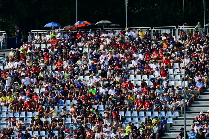 The fans watch from the grandstands.