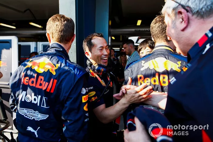 Red Bull team personnel celebrate a podium finish for Max Verstappen, Red Bull Racing